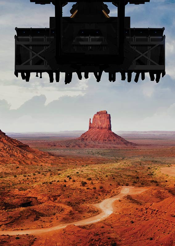 Flight ride seating in front of a landscape view of three tall desert rock formations.