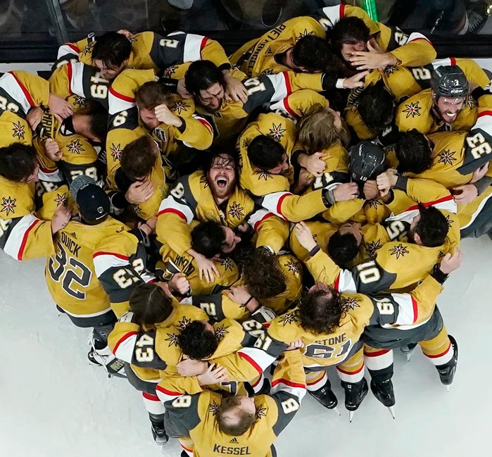 Vegas Golden Knights hockey team in a celebratory hug.